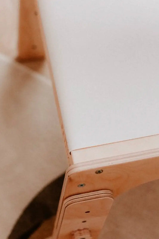 kids playing with paper roll with table holder